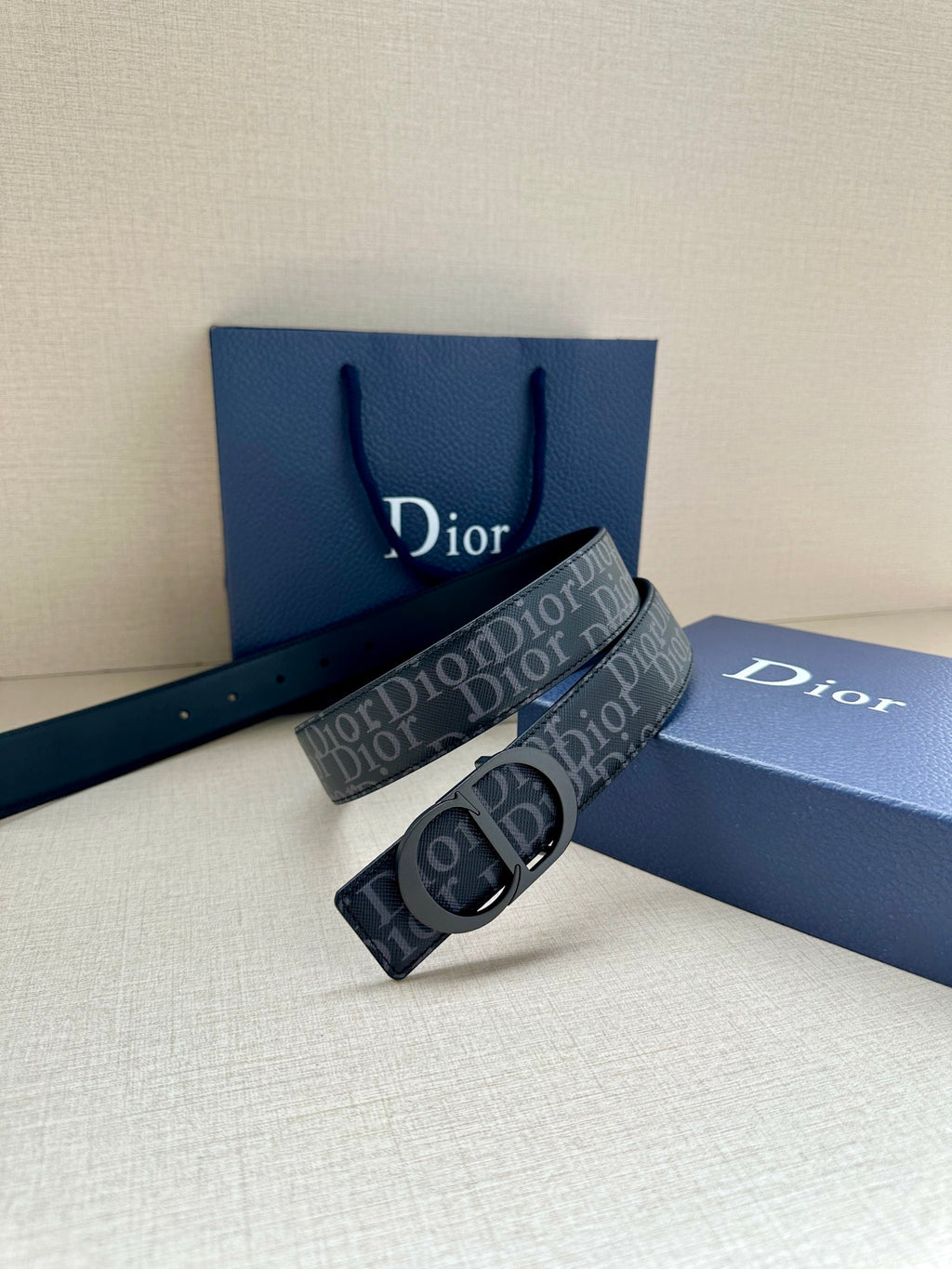 Dior belt with repeating Dior canvas strap and dark blue keeper with silver buckle
