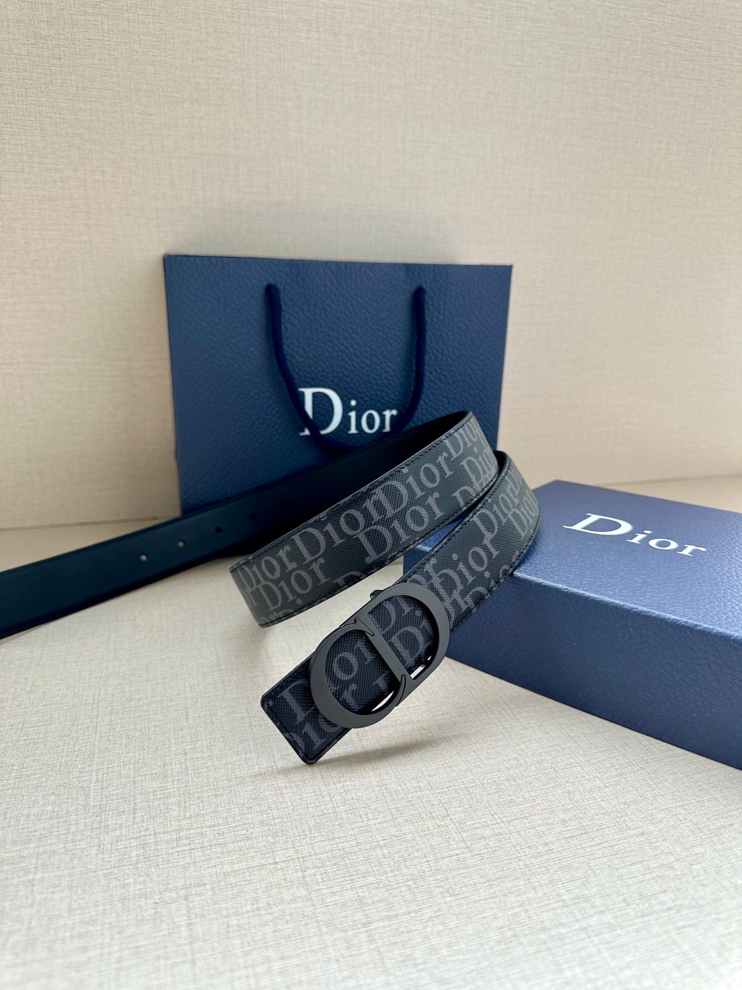 Dior belt with repeating Dior canvas strap and dark blue keeper with silver buckle