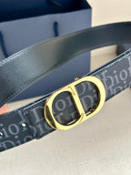 Dior belt close-up: dark monogram strap with gold CD buckle and contrast stitching
