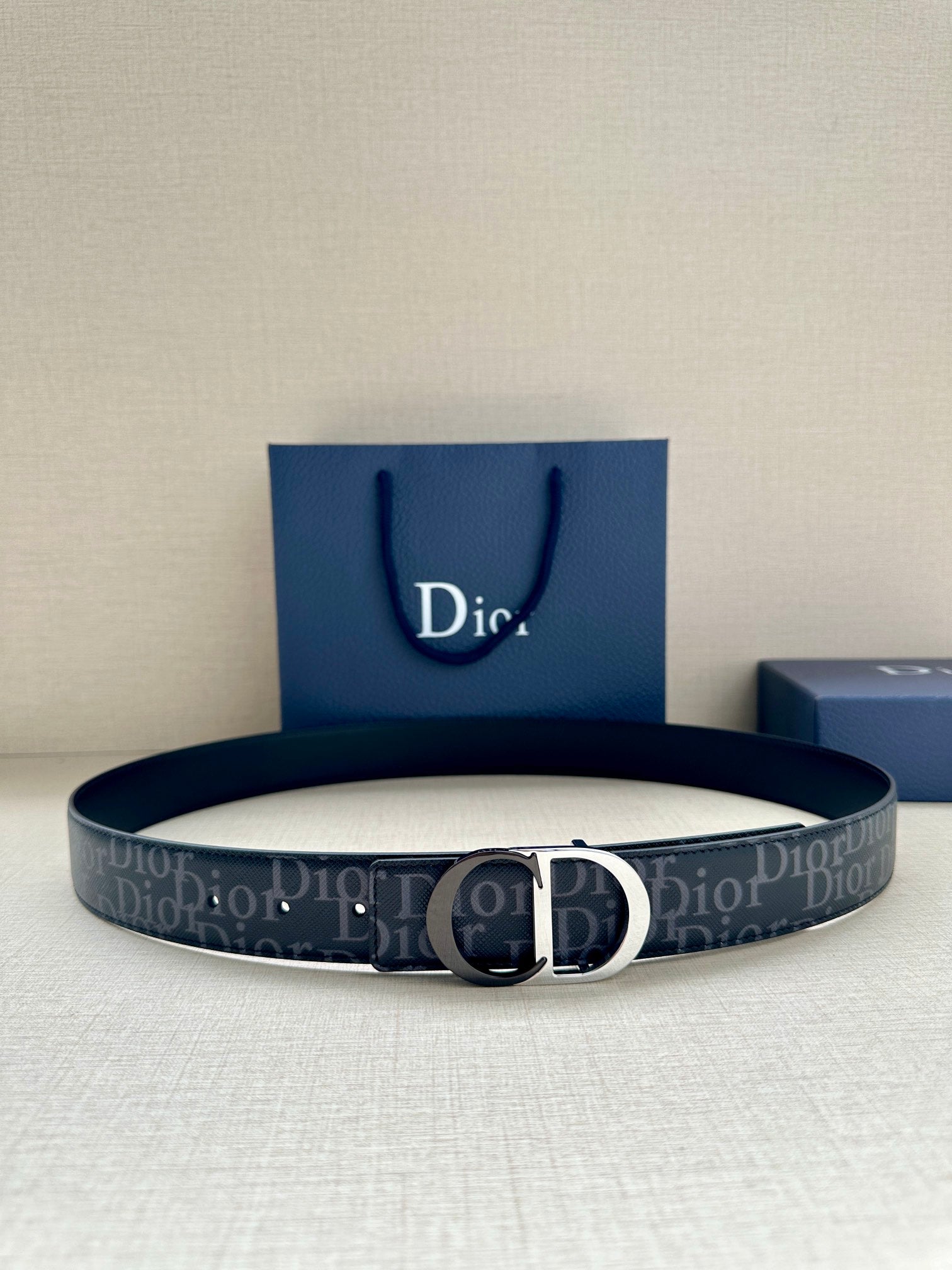 Dior Oblique belt with silver CD buckle and dark blue patterned strap
