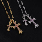 Gold cross pendant necklace with purple stone accents and linked chain