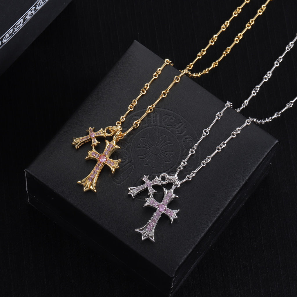 Gold and silver cross pendant necklaces with purple gem inlay