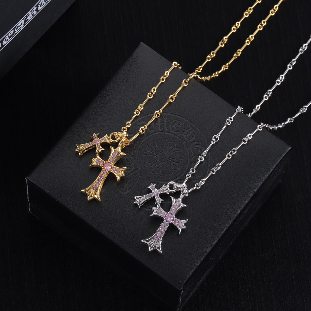Gold and silver cross pendant necklaces with purple gem inlay