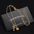 Gold-tone pendant necklace set with cross, star, and round charm pendants