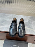 Prada unisex leather loafers, dark color, with strap detail and low heel