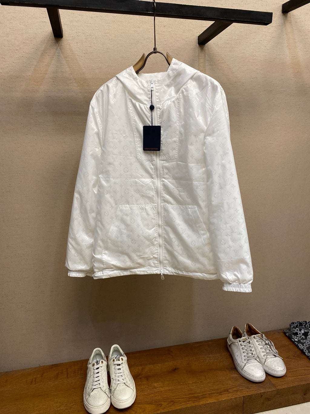 Louis Vuitton white hooded zip jacket, long sleeves, front view with hanging tag