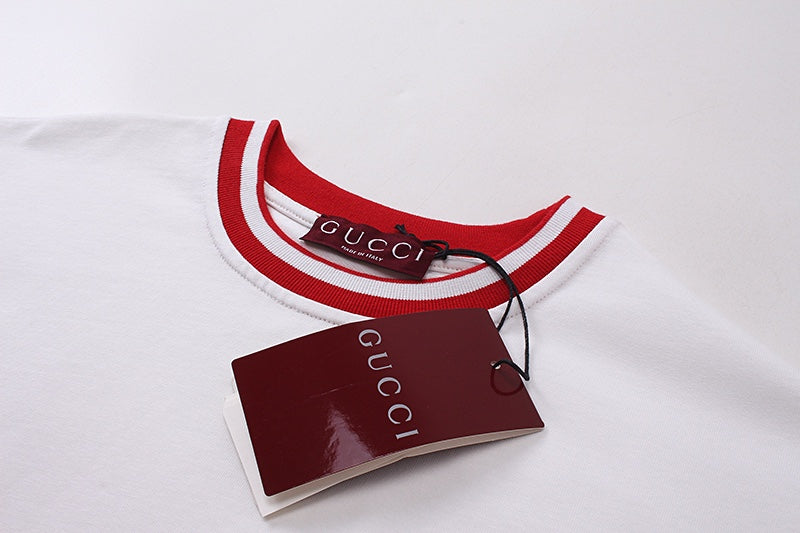 White Gucci T-shirt collar with red ribbed trim and attached Gucci tag