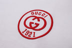 Gucci 1921 round logo patch on white T-shirt