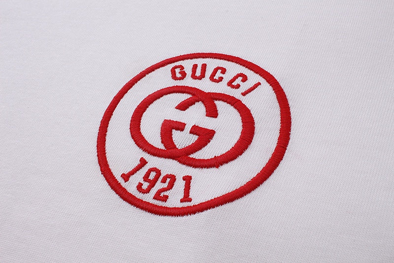 Gucci 1921 round logo patch on white T-shirt