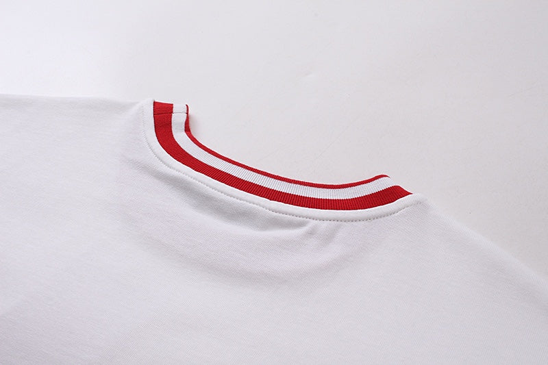 White T-shirt neckline with red ribbed collar trim