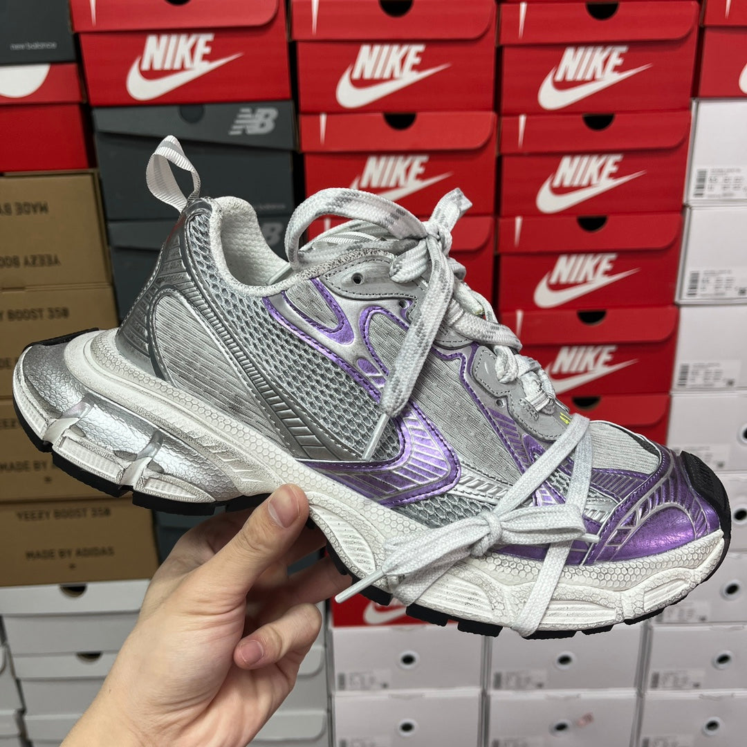 Unisex Balenciaga sneakers in metallic silver with purple side accents and laces