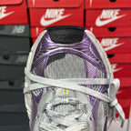 Unisex sneakers, rear view with black sockliner and purple heel stripe