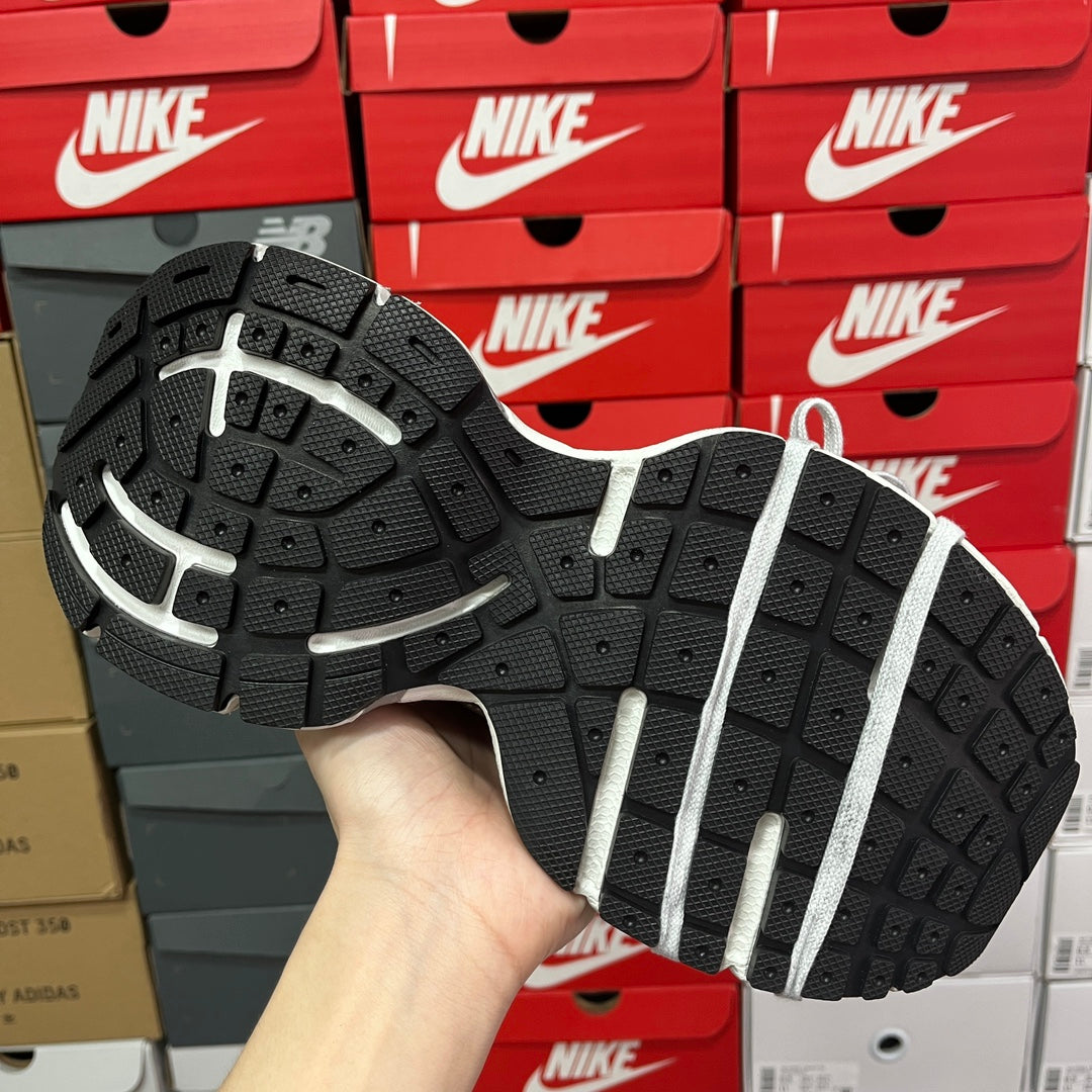 Unisex sneakers outsole view with black tread and white stripe detail