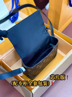 Louis Vuitton monogram crossbody bag with open flap and blue leather trim