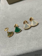 Bvlgari earrings set: gold half-moon studs with iridescent white and green enamel.