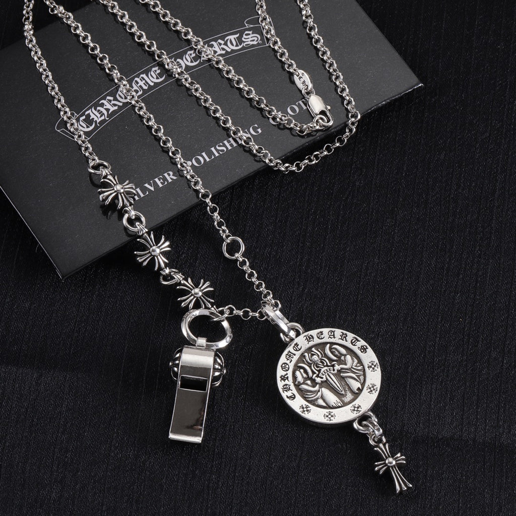 Silver-tone layered charm necklace set with round pendant, ring clasp, and long dangles