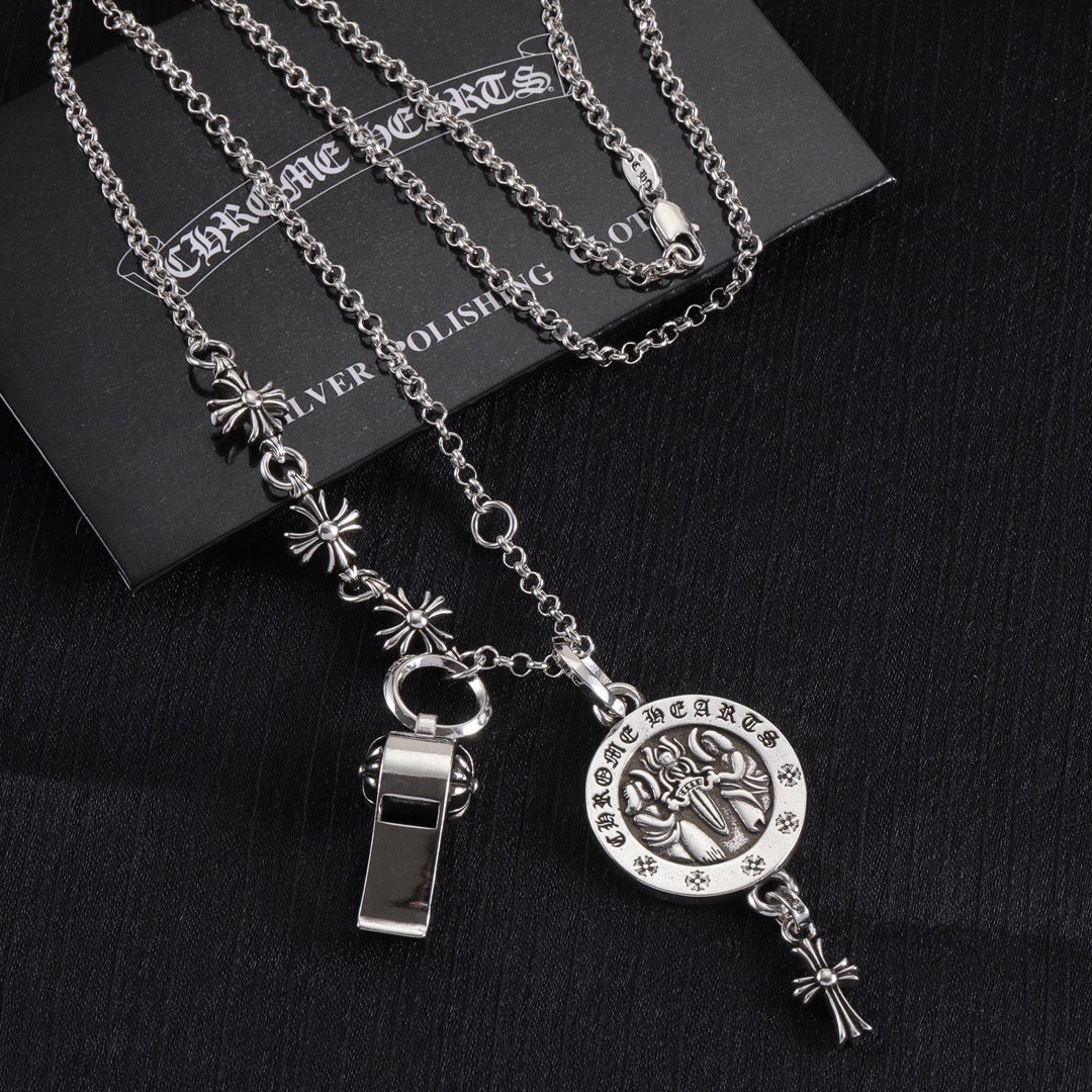 Silver-tone layered charm necklace set with round pendant, ring clasp, and long dangles