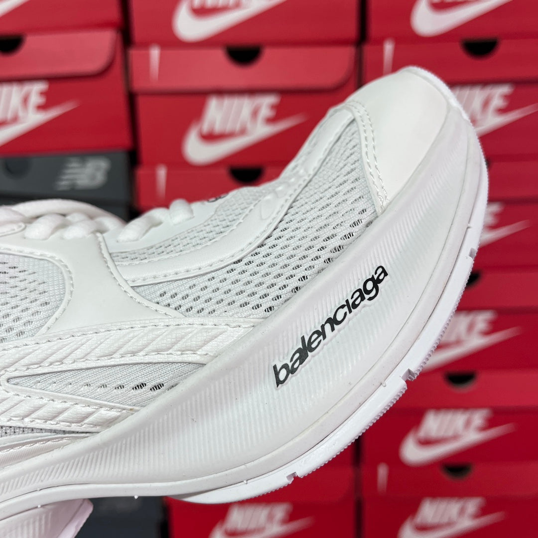 White Balenciaga sneaker side with logo print and ribbed sole edge