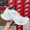 White Balenciaga unisex sneakers with mesh uppers and lace-up front
