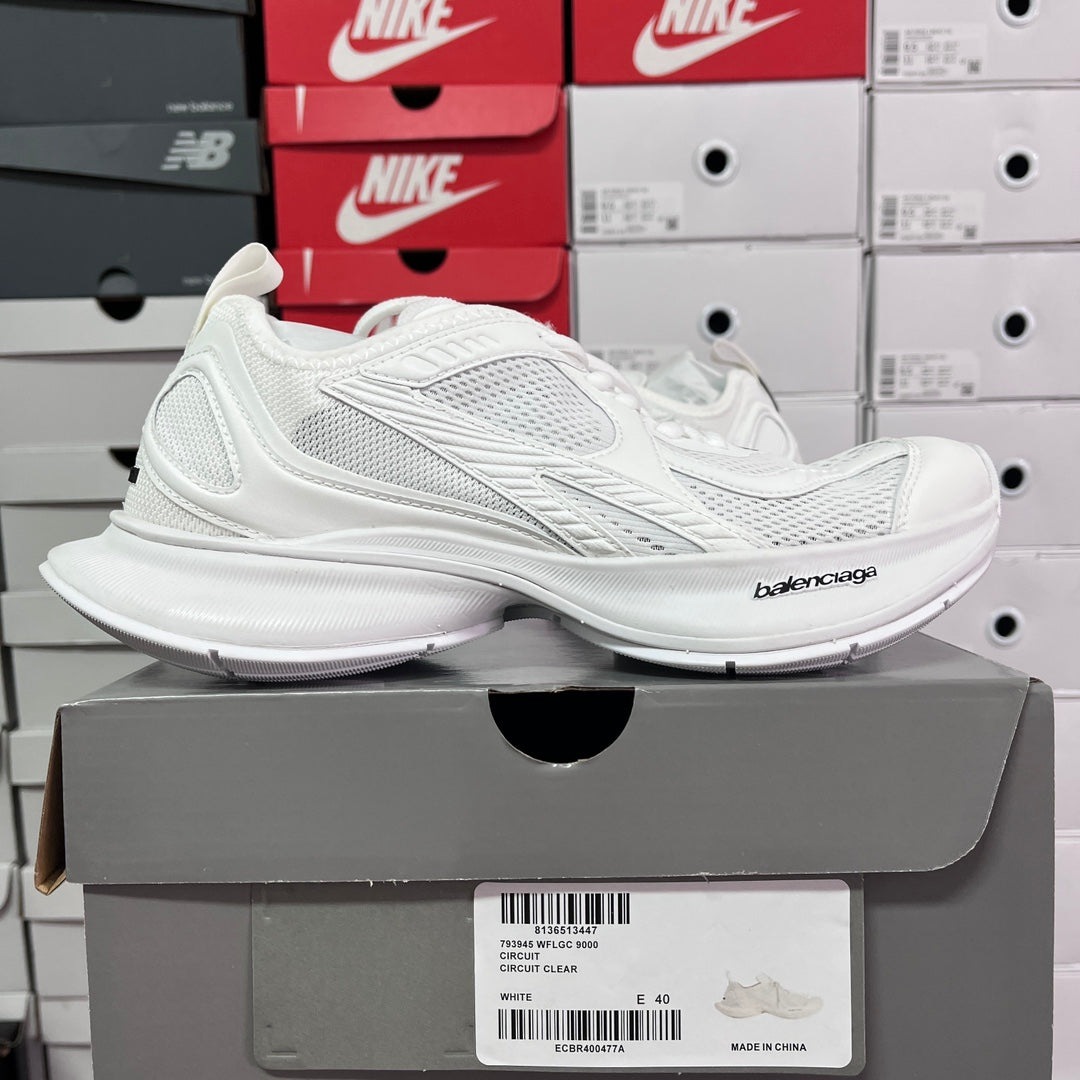 White Balenciaga sneakers with textured side stripes and cushioned sole
