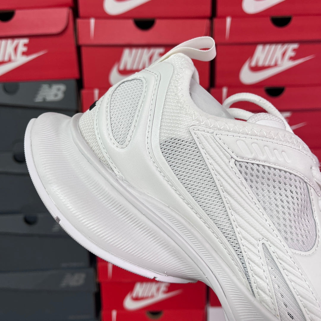 White Balenciaga sneaker on angled view, lace-up with cushioned midsole