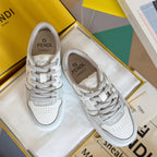 White Fendi unisex leather sneakers, lace-up with logo accents on tongue and side.
