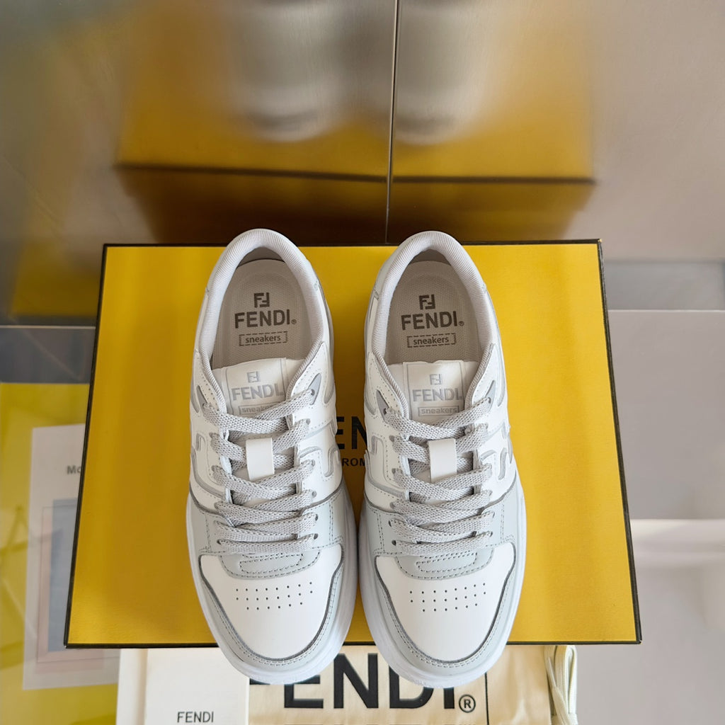 White Fendi unisex sneakers, front view pair with lace-up eyelets and logo on tongues.
