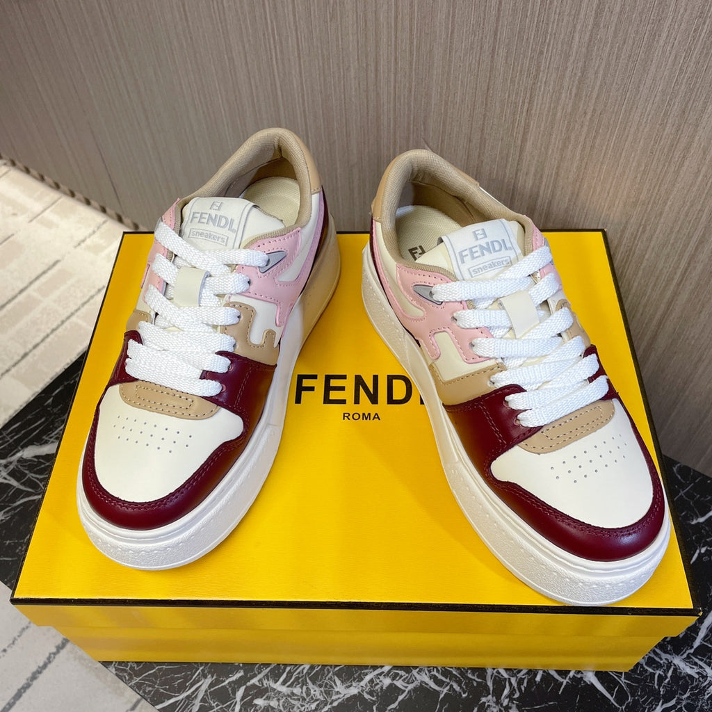 Pair of lace-up sneakers with Fendi branding on tongue, burgundy and blush color accents