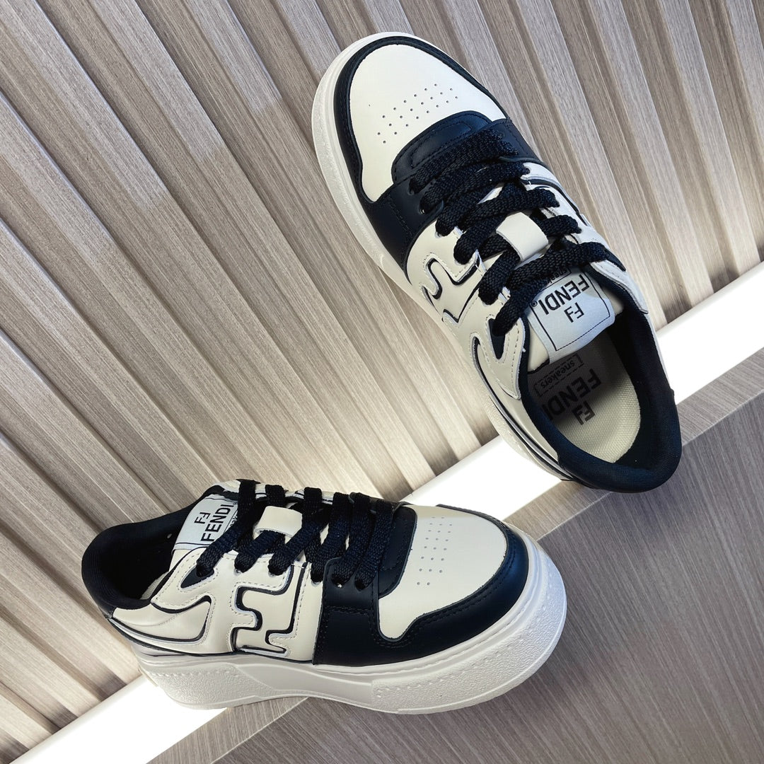 Fendi unisex sneakers, side view with white uppers, black accents, lace-up