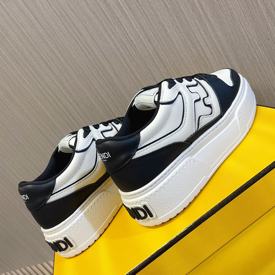 Fendi unisex sneakers, angled view showing white and black uppers and sole