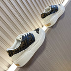 Fendi low-top sneakers with white sole and blue-tinted dark logo panels