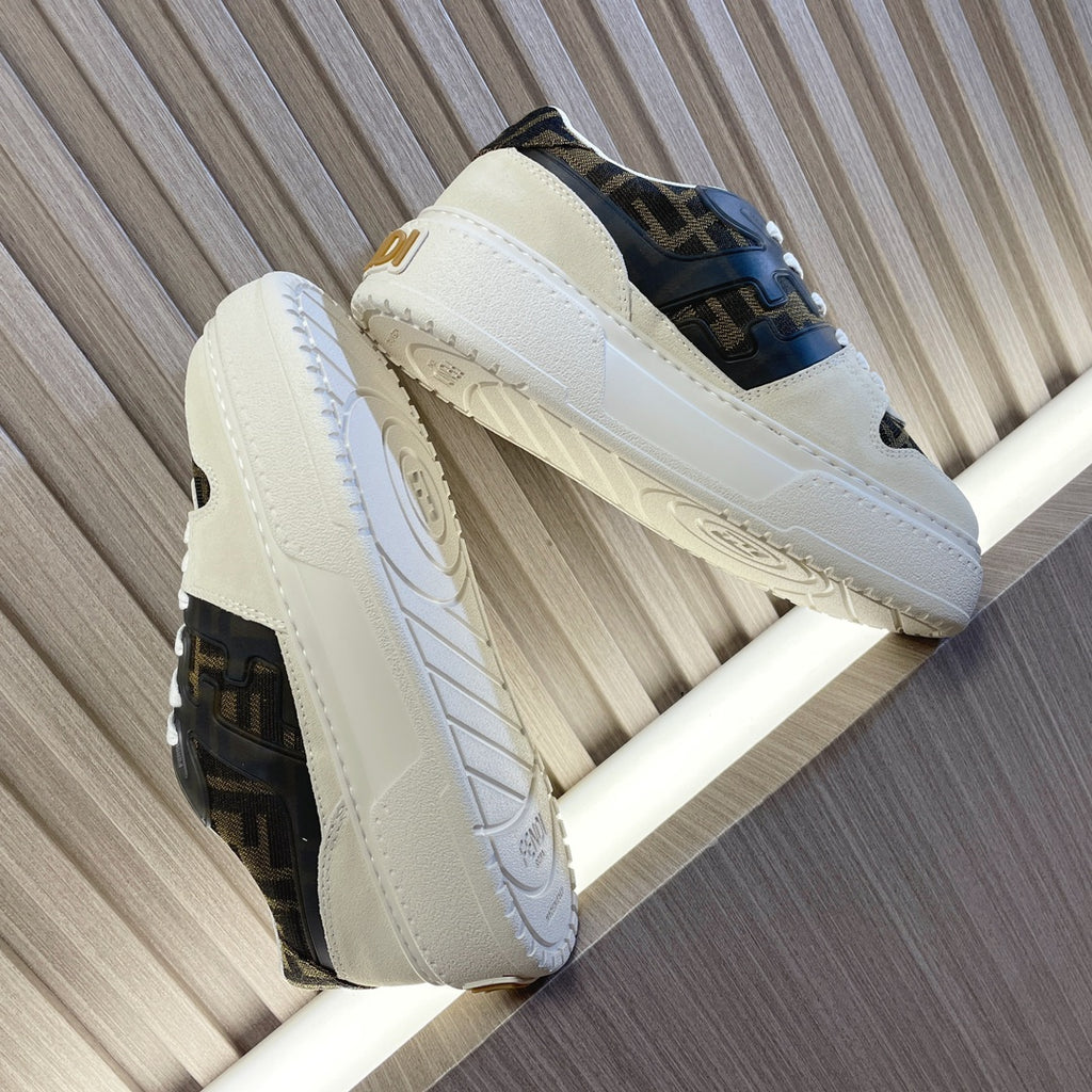 Low-top sneakers side view with white uppers, dark logo panels, and thick white sole.