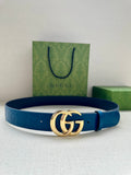 Blue leather belt with silver-tone GG buckle, laid flat with box and bag nearby