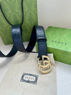 Gucci belt with dark blue strap, silver-toned hardware, and buckle detail