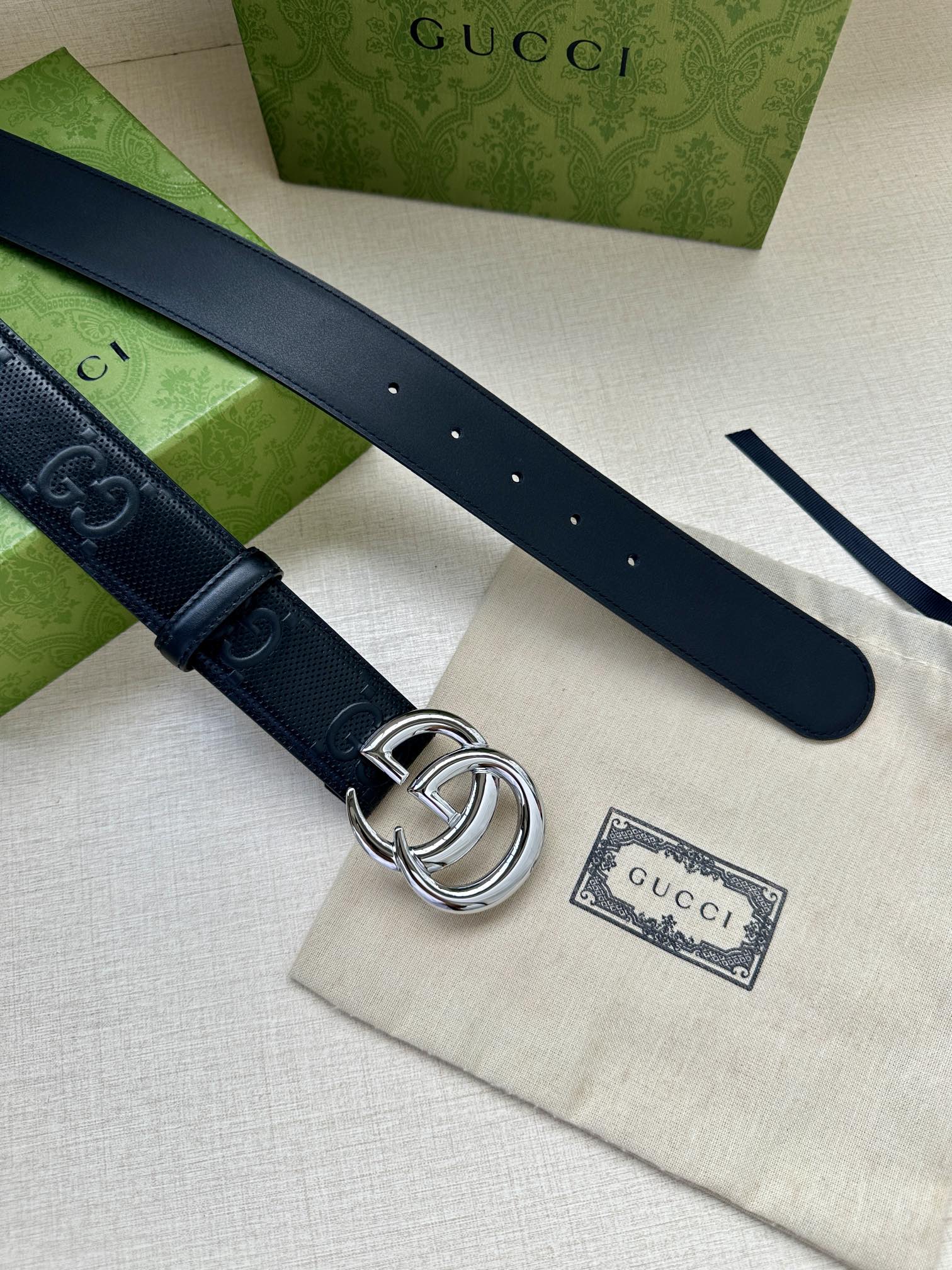 Gucci belt pair, dark blue straps with silver interlocking buckle and holes