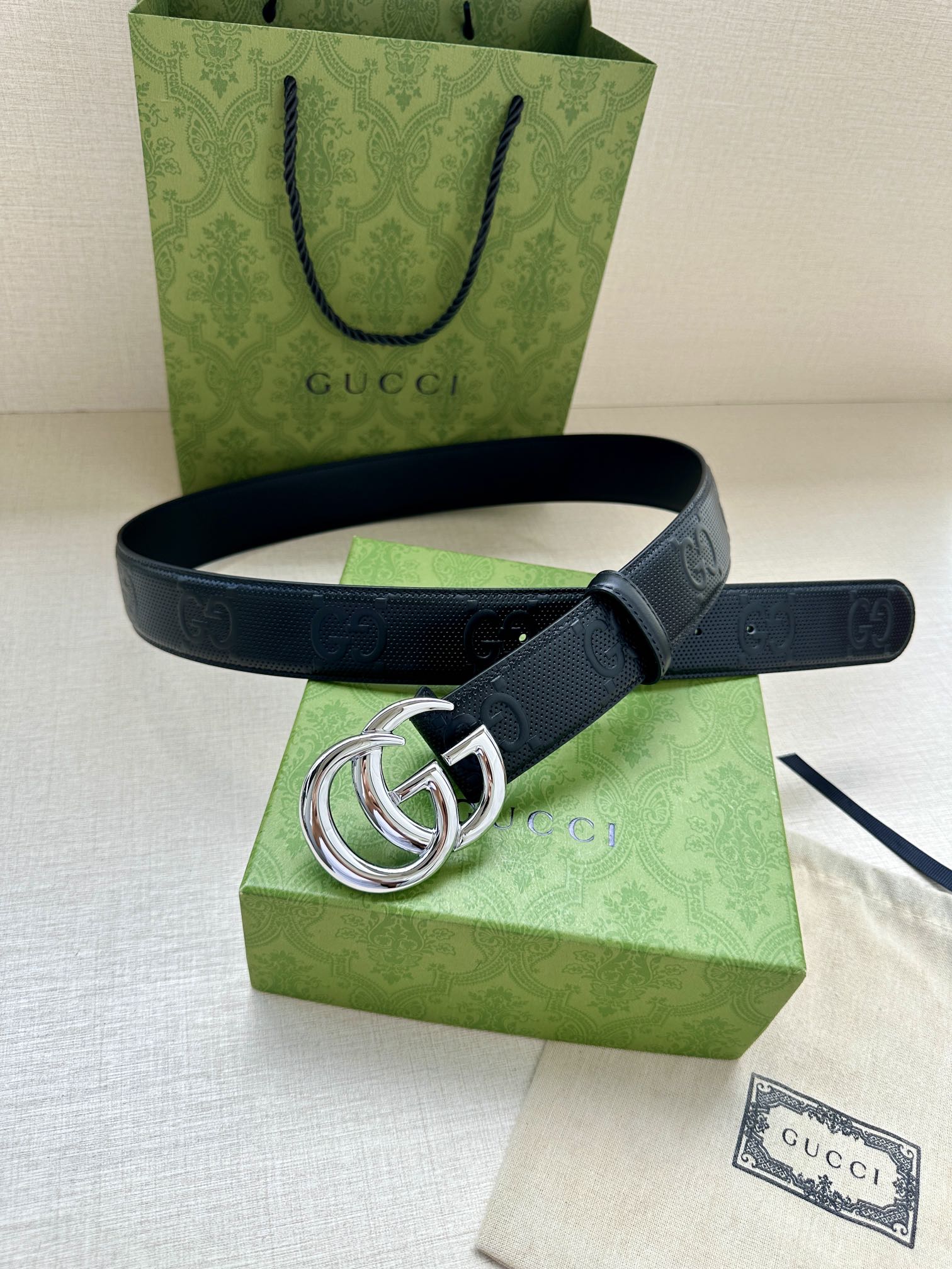 Gucci belt dark blue strap with silver double-G buckle and embossed logo