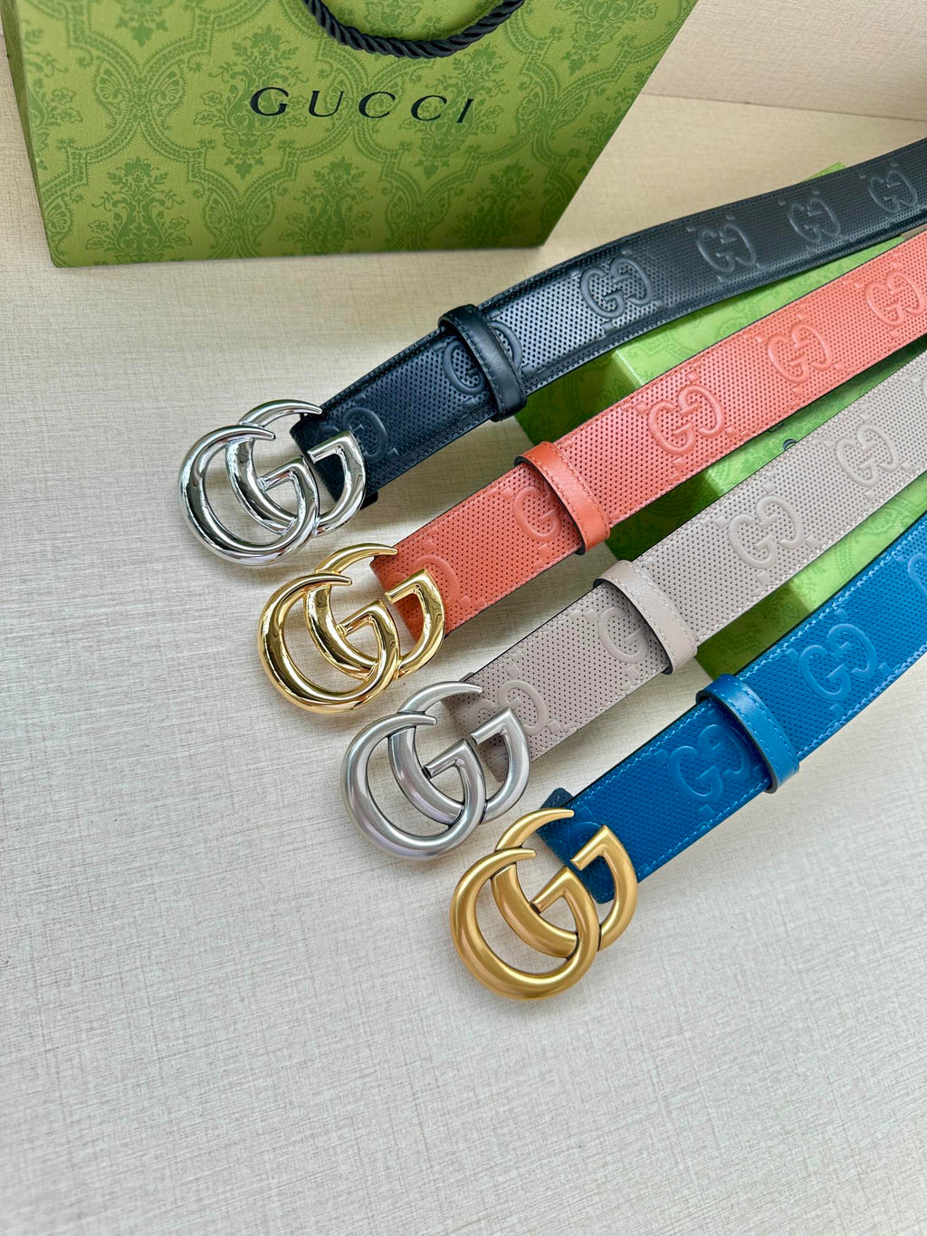 Gucci belt set with colorful straps and interlocking G buckle hardware