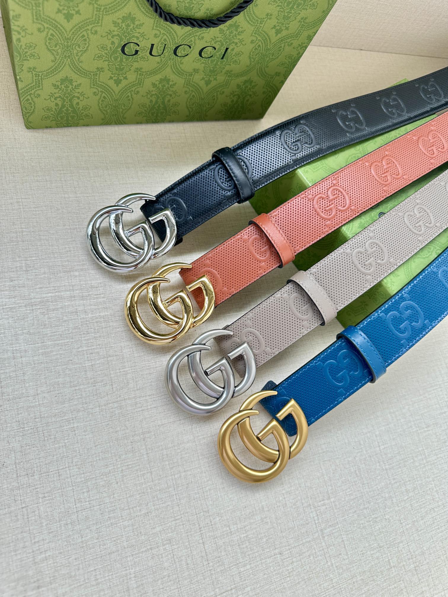 Gucci belt set with colorful straps and interlocking G buckle hardware