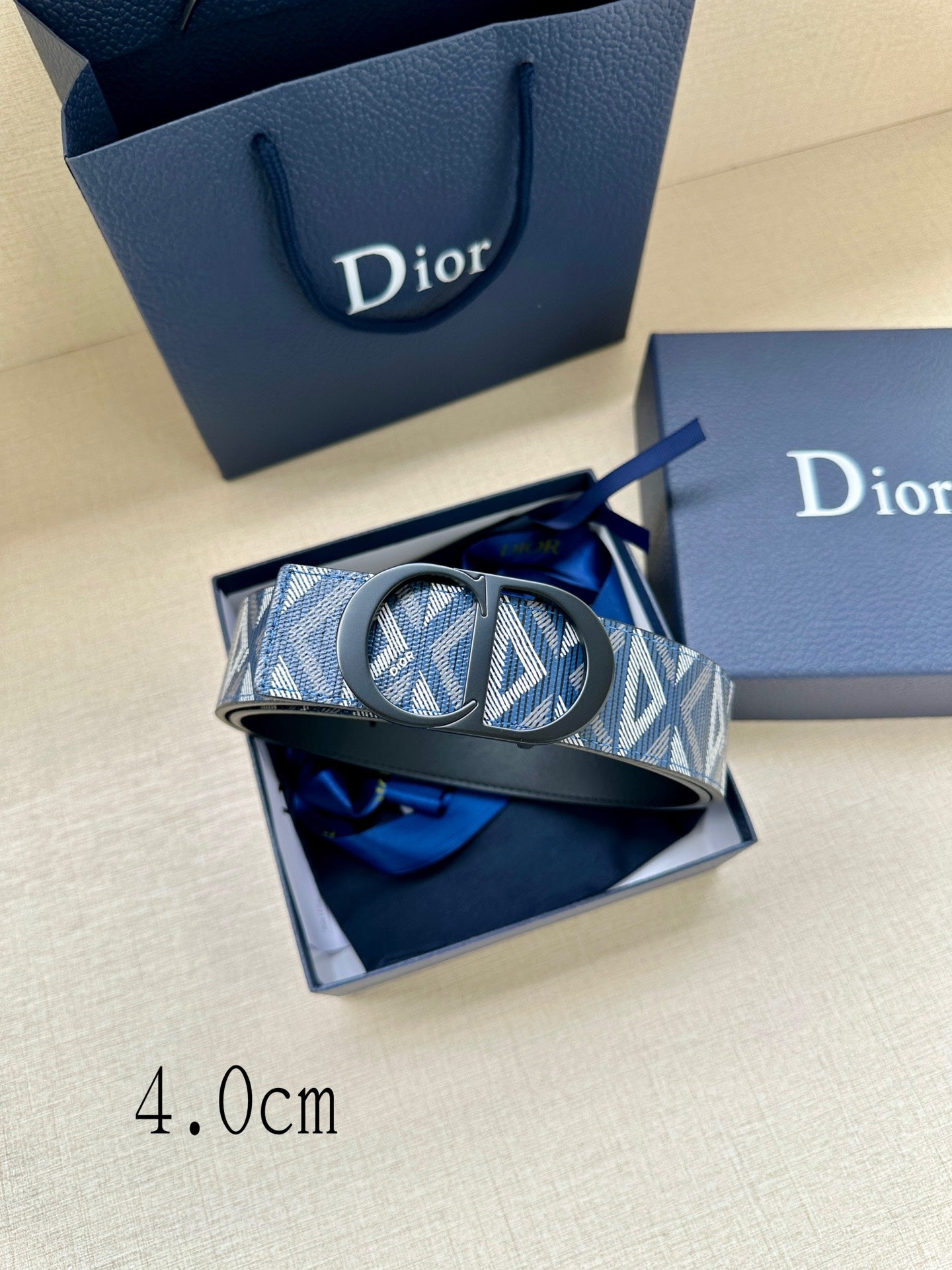 Dior monogram belt with blue-and-white patterned strap and black oval buckle