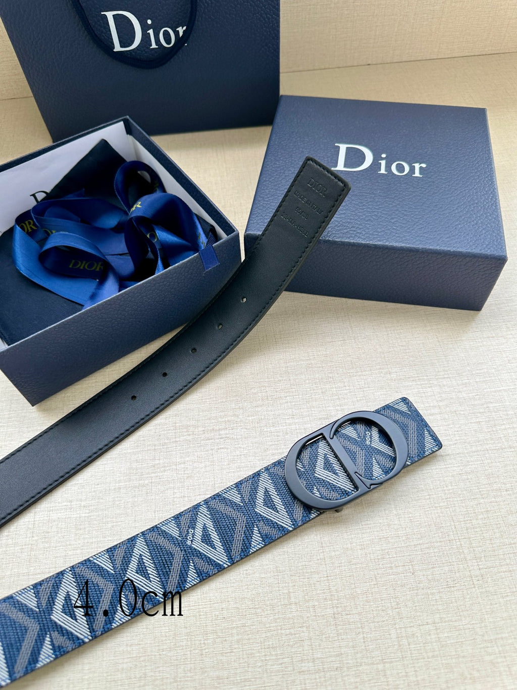 Dior monogram belt with blue-and-white patterned strap, black buckle and holes
