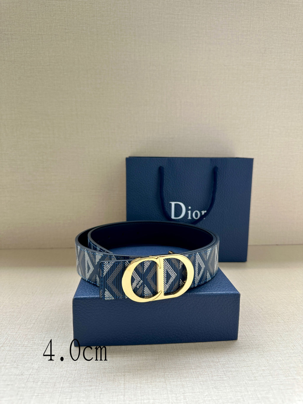 Dior belt with patterned blue strap and gold CD buckle