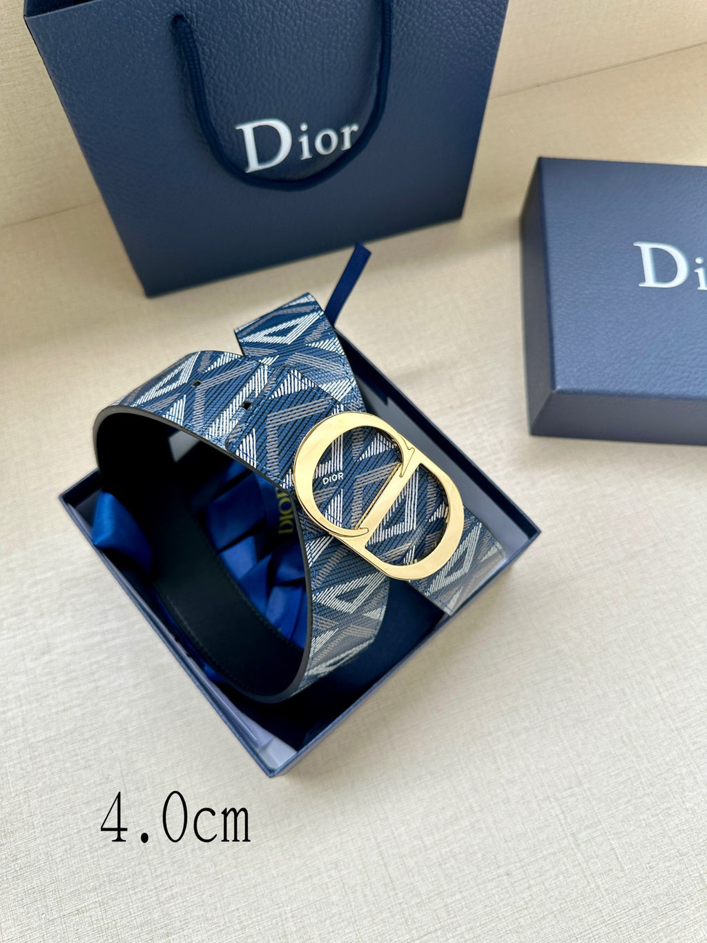 Dior belt with blue geometric strap and gold CD buckle