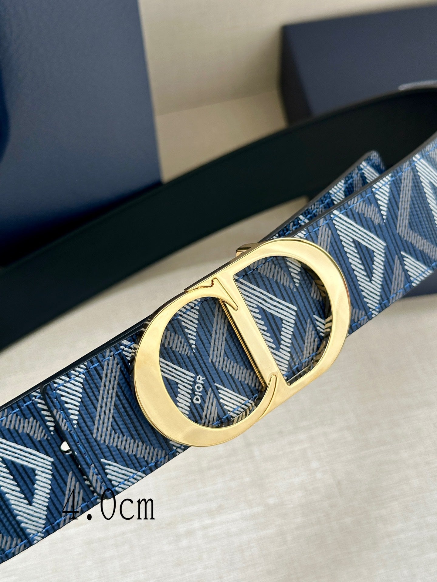 Dior belt detail: blue jacquard strap with gold CD buckle