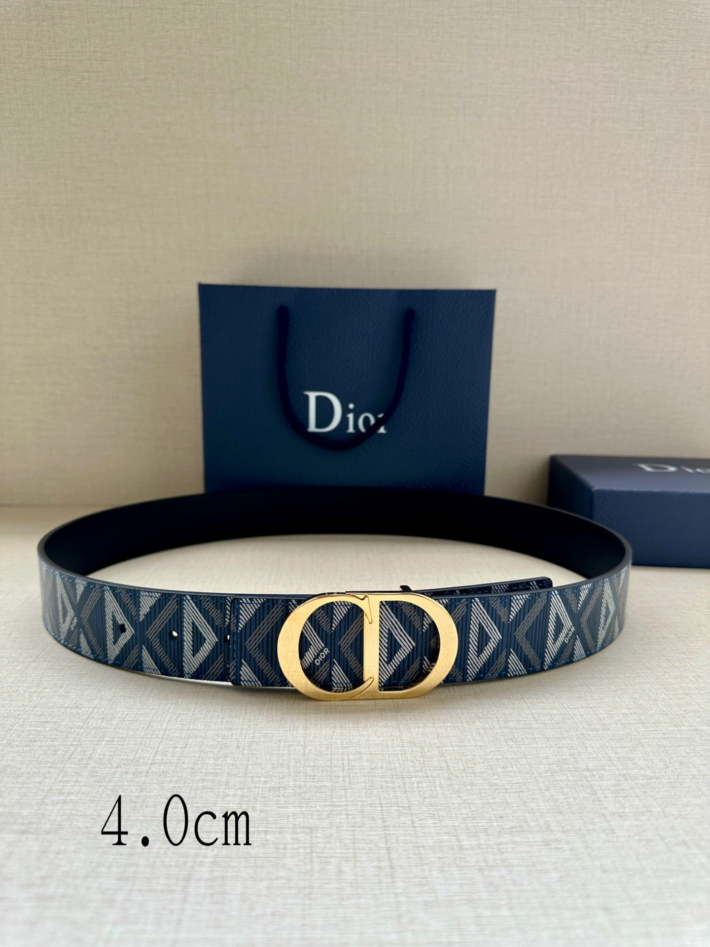 Dior belt with blue geometric jacquard strap and gold CD buckle
