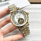 Rolex gold-tone wristwatch with open-heart dial and jubilee bracelet