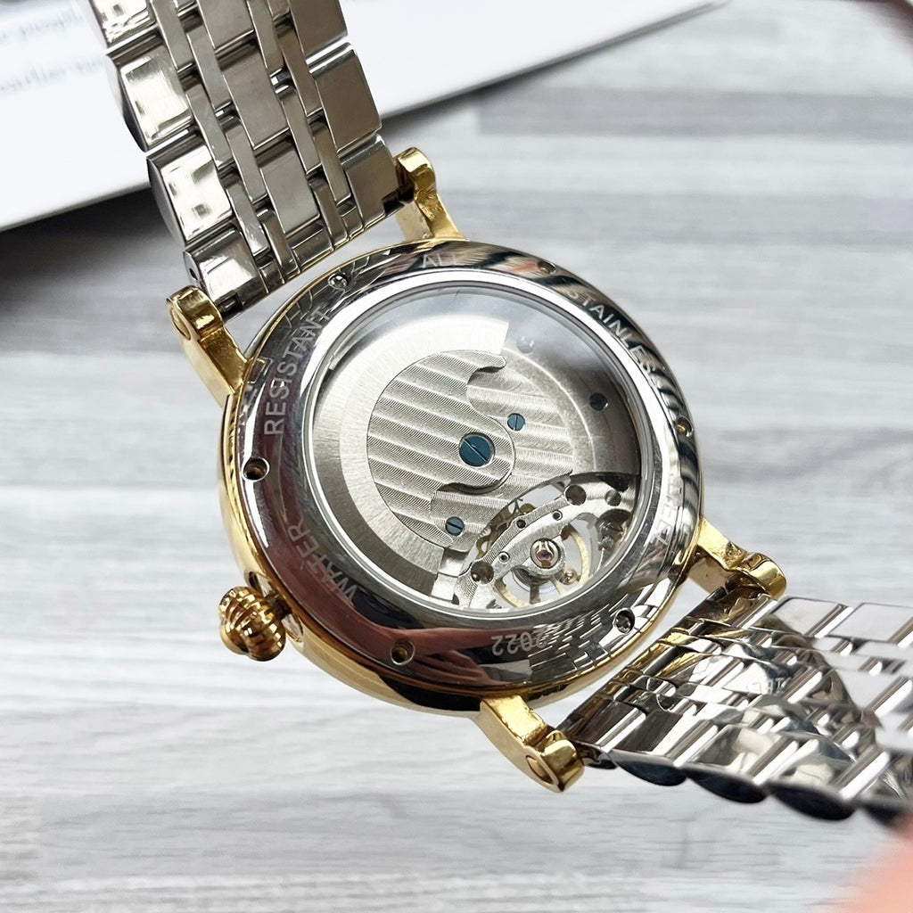 Rolex gold-and-silver wristwatch with see-through caseback and metal bracelet