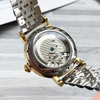 Rolex gold-and-silver wristwatch with see-through caseback and metal bracelet