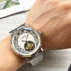 Rolex silver-tone wristwatch with white dial and open-heart movement