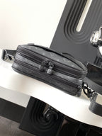 Crossbody bag in dark gray monogram canvas with front zipper and leather strap