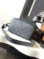 Crossbody bag with dark gray monogram canvas and wide leather shoulder strap